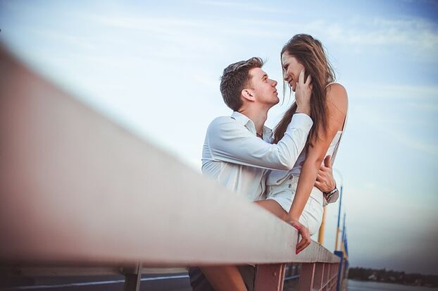 A woman in the arms of a man with excellent potential